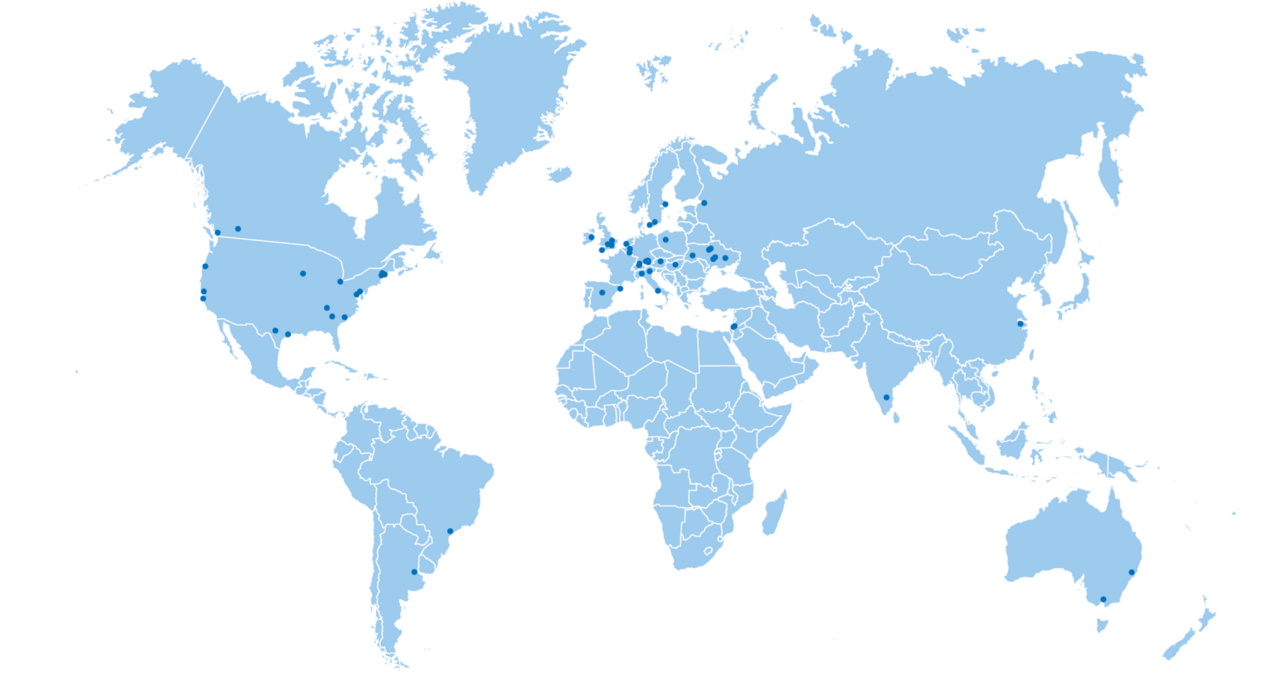 Graphic world map in light blue, on which dark blue dots show the places of origin of the fellows.