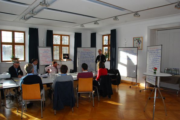 Eight participants in group work on societal issues