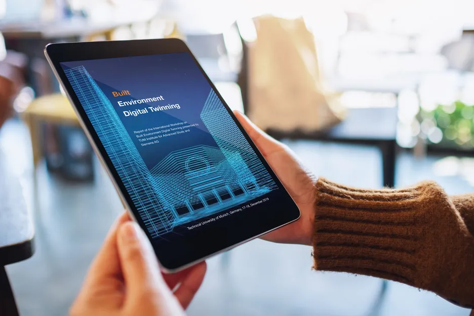Tablet showing the digital version of the International Workshop Report on Built Environment Digital Twinning.
